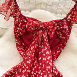 Fongt Sweet Design With A Knotted Bow Tie With Bare Back To The Waist Of A Floral Dress