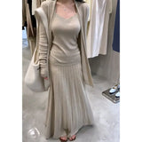 Fongt The Autumn Of 2025, The New Women's Long-Sleeved Knitted Cardigan Is Hoisted With A High-Rise Half-Body Skirt.